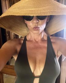 Catherine Zeta-Jones Makes Summer Hotter in Plunging Swimsuit