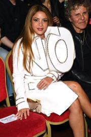 Shakira Makes a Cryptic Style Statement in ‘NO’ Coat at Fashion Week