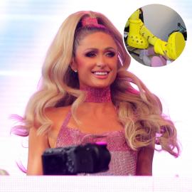 Watch Paris Hilton Struggle to Remove Gigantic Yellow Crocs Boots