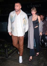 Taylor Swift and Travis Kelce Hold Hands After Surprise ‘SNL’ Cameos