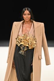 Naomi Campbell Closes Out Paris Fashion Week in Artful Gold Headpiece