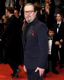 Gary Oldman Makes Rare Appearance With Wife and Stepson at Cannes