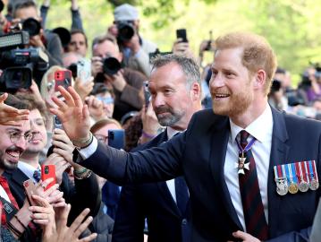 Prince Harry Beams as Fans Line Streets After King Charles Reunion Fail