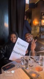 Simone Biles Poses With Custom 'Olympic F–king Champion' Menu at Dinner