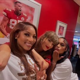 Taylor Swift Poses With Eras Tour Poster in Travis' Arrowhead Suite