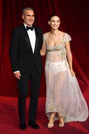 Joaquin Phoenix Sweetly Fixes Rooney Mara's Train at Academy Gala