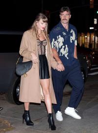 Taylor Swift and Travis Kelce Pack on the PDA at Yankees Playoff Game