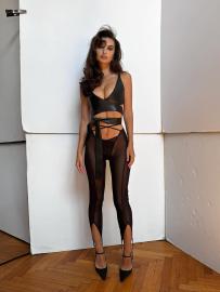 Emily Ratajkowski Smolders in Cleavage-Baring Leather Top and Sheer Pants
