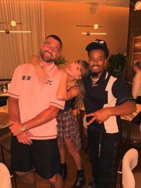 Taylor Swift Rocks Miniskirt and Crop Top as She Cozies Up to Travis Kelce