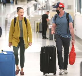 Hugh Jackman and Sutton Foster Keep It Flirty and Fun During Airport Outing
